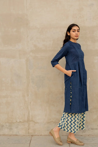 Women's indigo pintuck kurta and culotte co ord set by Vrajbhoomi styled as an elegant Indian-inspired outfit for daytime outings and casual gatherings.