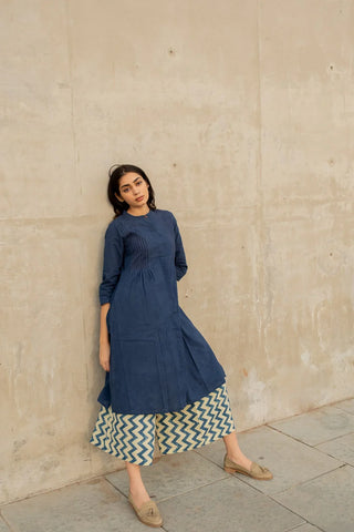 Vrajbhoomi women's indigo pintuck kurta and culotte set featuring a cotton kurta paired with matching hand block printed culotte pants, styled as an elegant Indian-inspired outfit for daytime outings and casual gatherings.
