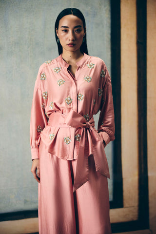 Women posing in a Dusky pink (Mauve) co-ord set featuring a delicate embroidered shirt, paired with pants and tie up belt offering a clean and elegant look perfect for effortless styling. Designed by Ease. 
Pefect dress for parties, formals, evening soiree, office, everyday, formal ceremonial events, casual, holiday vacation or for resort.