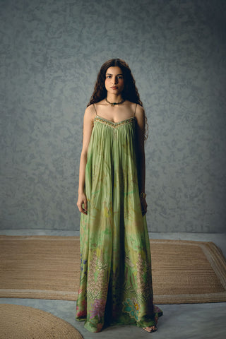 Woman in Pista Green floral organza silk jumpsuit with a flowy silhouette, perfect for party wear, formal events, resort looks, vacation styling, holiday outfits, soirées, and wedding receptions. Designed by Paulmi and Harsh and Ease. Shop this elegant statement jumpsuit online.
