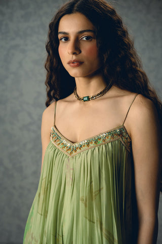 Woman in a statement red floral chic jumpsuit all set ready to go to evening soiree